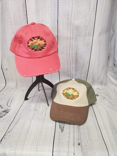 Two trucker hats, one red and one green, displayed side by side on a wooden background. The red hat has a visible brand logo on the front.